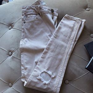 Ripped cream jeans